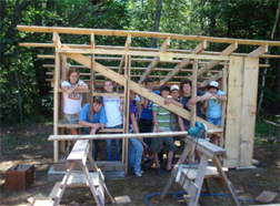 Volunteers building a shed at the UMaine 4-H Camp & learning Center at Tanglewood