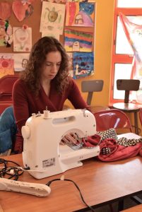 Elaine using sewing machine