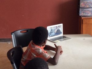 young person watching a video on a tablet screen