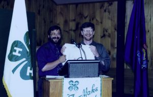 Ron Drum presents John Rebar with a t-shirt at the 1996 4-H Banquet
