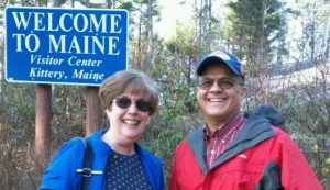 Phyllis and Eddie in front of "Welcome to Maine" sign at the Visitor Center, Kittery, Maine