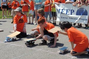 Youth competing in Solar Sprint with their solar-powered vehicles