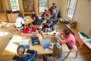 Students enrolled in the Telstar Program at Bryant Pond using computers in a classroom with their instructor
