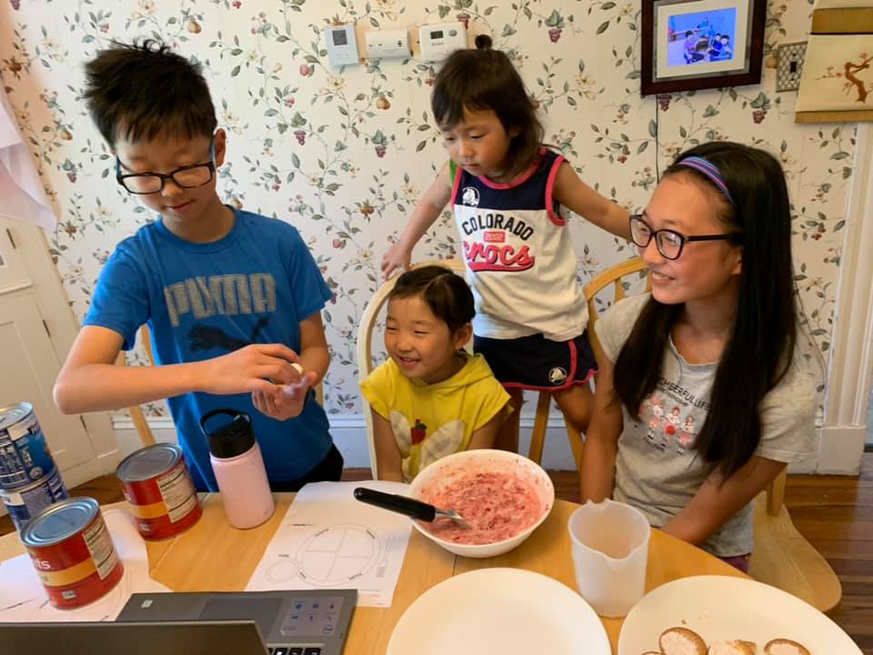 Participating as a family in the 'Eat Well, Be Well with Summer Snacks' Workshop. Photo Credit: Joyce H.