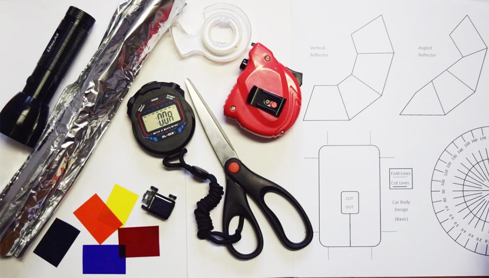 a photo of various materials to build a solar car as well as some plan sketches