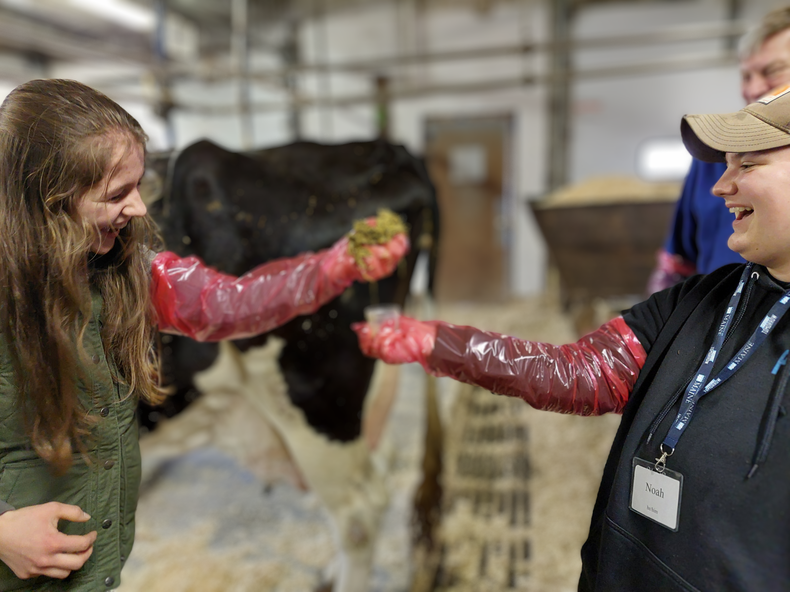 4-H member holding bovine rumen sample.