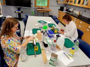 staff preparing science experiments