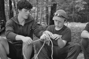 2 4-H'ers practice tying knots