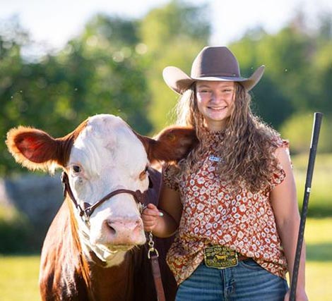 Elizabeth Graustein pictured with a cow