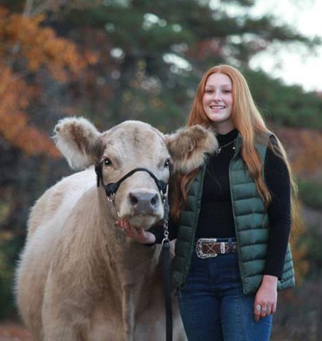 Elizabeth Grondin pictured with a cow