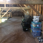 containers stacked in barn loft area