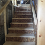 interior staircase with railing to barn loft