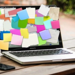 sticky notes covering a lap top screen