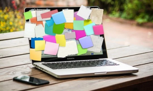 sticky notes covering a lap top screen