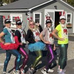 five women in running gear and dressed silly like obsters
