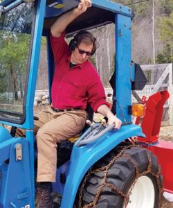 person demonstrating side bend in a tractor