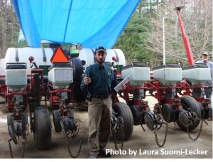Man standing in front of no-till planter