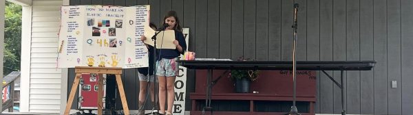 A youth giving a presentation on a stage