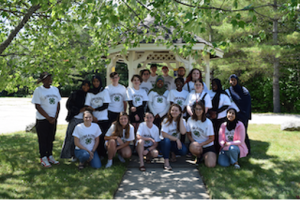A large group of 4-H Summer of Science interns and teen leaders posing for a photo together in front of a gazebo.