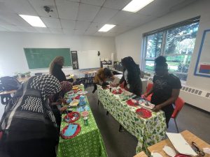 Teens decorating cakes together.