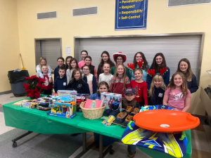 Midcoast Mainers members posing with gifts.