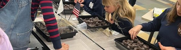 Children planting seeds.