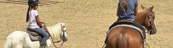Two Midcoast Mainers members riding horses.