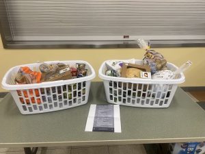 Two laundry baskets filled with donated foods.
