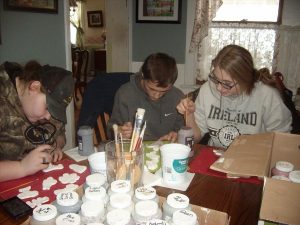 4-H Paca Pals Club members working on projects