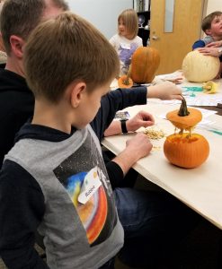Boy holding pumpkin