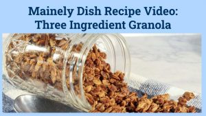 small canning jar on it's side with granola in it