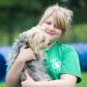 4-H youth holding a dog