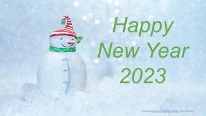 happy new year 2023 with snowman green scarf and red hat in a snowy blue background