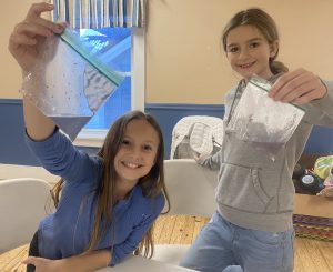 two girls with their experiment