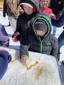 youth making maple taffy