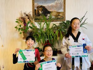 3 girls with public speaking certificates