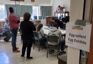 4-H members learning about eggs