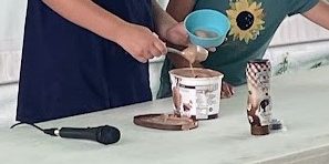 two girls doing a demonstration on an icecream sundae