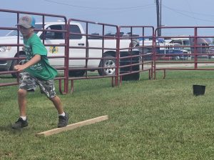 boy running an obstacle course