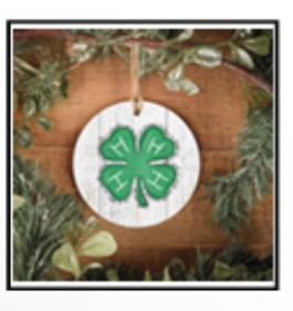 green fir tips with 4-H logo in the middle