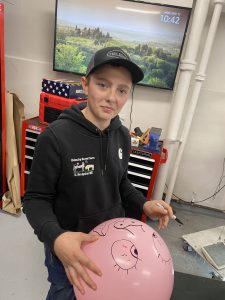 boy with balloon pig