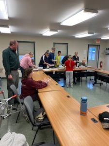 4-H members and adults preparing for their food giveaway