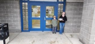 two youth with food to give away