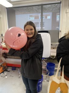 girl with balloon pig