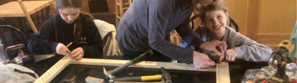 youth learning to use a screw gun