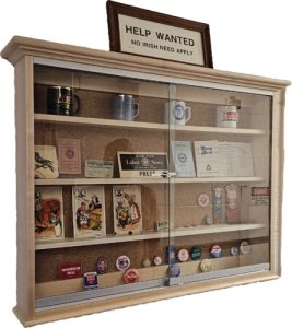 Bureau of Labor Education wall display case showing union pins, NALC cups, and small documents