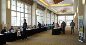 a row of vendors at the 2023 Wild Blueberry Conference in the hallway