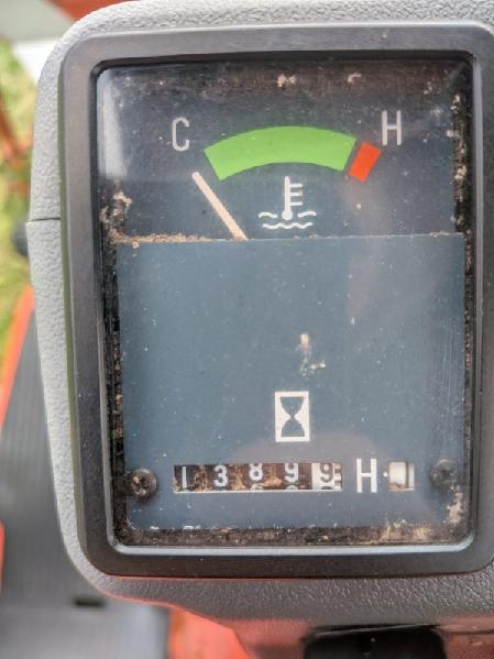 Odometer showing the hour meter (1,389.9) of a Kubota GF1800 front-mount tractor.