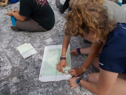 Trip leaders reviewing a map