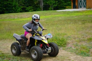 camper riding an ATV